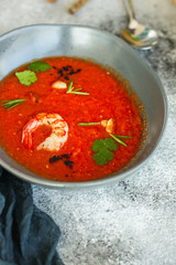Gazpacho soup with shrimps prawns (red seafood soup) serving. food background. copy space