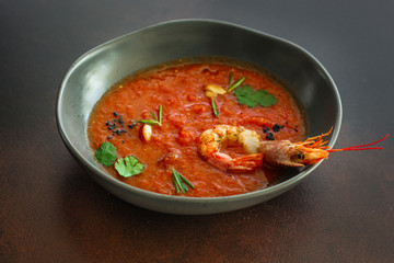 Gazpacho soup with shrimps prawns (red seafood soup) serving. food background. copy space