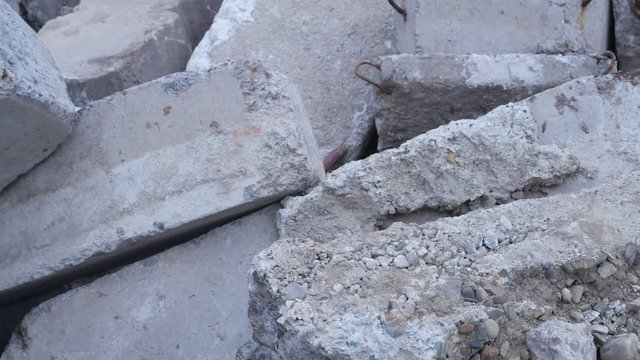Old dismantled reinforced concrete products, background