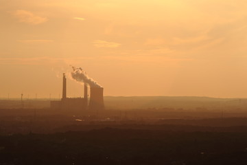 Fototapeta na wymiar industrial power plant at sunset