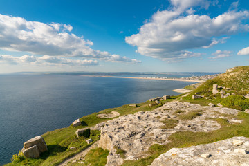 South West Coast Path on the Isle of Portland, looking towards Fortuneswell and Chesil Beach with Weymouth in the background, Jurassic Coast, Dorset, UK