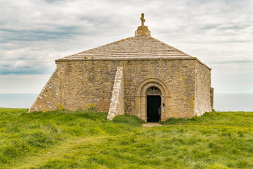 St Aldhelm's Chapel, seen on the South West Coast Path near Emmett's Hill, Jurassic Coast, Dorset, UK