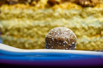 A slice of sponge cake with walnuts close-up.