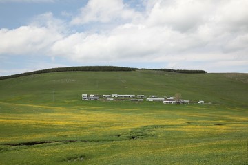 Sunny summer landscape with river.Green hills,fields and meadows