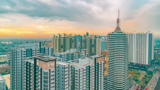 Metro Manila time lapse, looking over city skyline at sunset in Manila, Luzon, Philippines. Aerial Timelapse 4K