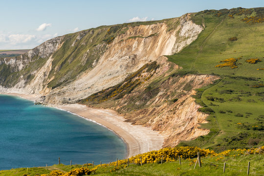 Walking on the South West Coast Path, looking at Worbarrow Bay, near Tyneham, Jurassic Coast, Dorset, UK