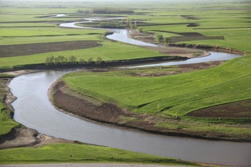 Meandering stream with mountains and clouds at The Persembe Plateau at Ordu, Turkey 