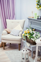 living room with flowers and armchair