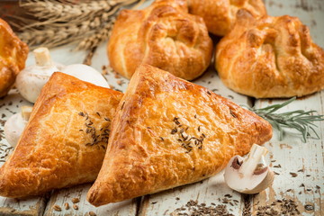 Puff pastry with champignon mushrooms close up