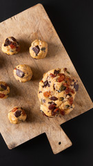 Healthy food concept Homemade raw dough of Trail Mix organic Whole grains Energy cookies on wooden board with copy space
