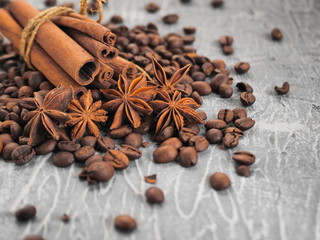 coffee cinnamon and star anise on gray background