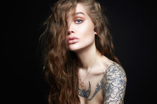 Sexy Young Woman with Tattoo