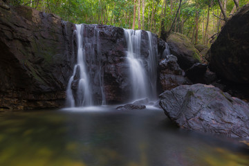 Naklejka na ściany i meble Waterfall in tropical forest