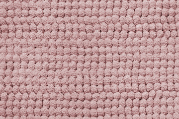 Pink texture. Closeup of a light seamless pink fluffy terry bath towel texture background for design and text. Macro.