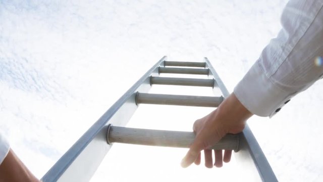 Personal perspective of a caucasian man climbing a ladder  themes of challenge opportunity motivation win career
