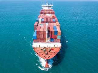 Large container ship at sea - Low angle aerial image.