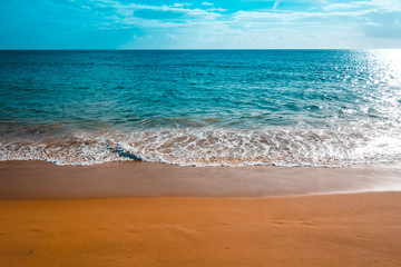 colorful beach with deep orange tonage and clean waves