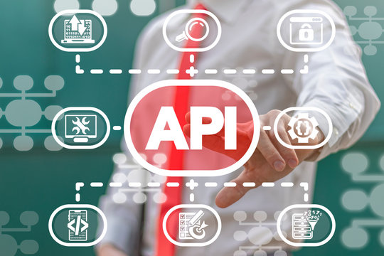 Man uses on a virtual screen of the future and touches the abbreviation: API. API Application Programming Interface concept.
