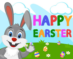 Easter Bunny waving his paw against the green lawn with colorful eggs.