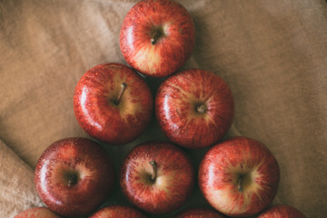 Ripe red apples piled as background. Top view of fresh apples. Organic fruit.   