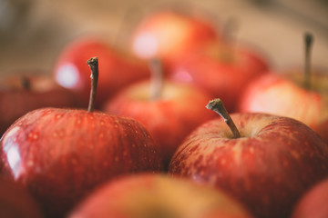 Macro view of red apples as background.