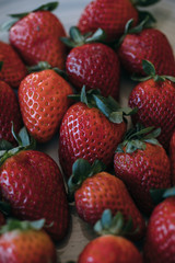 Obraz premium Strawberries background. Close up of fresh strawberries as texture and background.