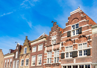 Fototapeta na wymiar row gable houses in Dordrecht on square called Statenplein, The Netherlands