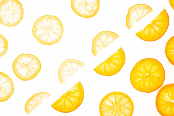 Sweet candied orange and lemon slice isolated on a white background. Flat lay, top view. Fruit composition
