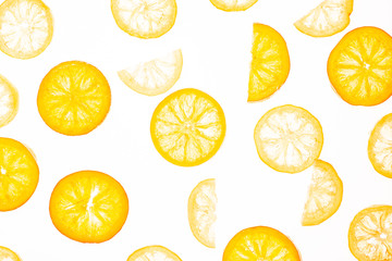 Sweet candied orange and lemon slice isolated on a white background. Flat lay, top view. Fruit composition