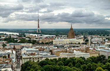 View over the rooftops of the city and TV tower in Riga from a height.