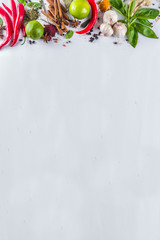 Various herbs and spices on white background top view copy space