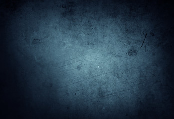 Blue textured concrete wall dark background