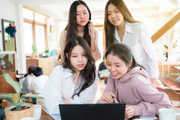 Office interior casual young business women talking discussion online business plan