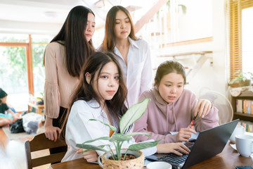 Office interior casual young business women talking discussion online business plan