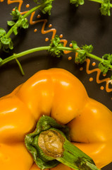 a freshest yellow paprika, bell pepper in ceramic plate