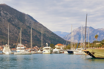 Fototapeta na wymiar Beautiful Mediterranean landscape. Montenegro, Adriatic Sea, Bay of Kotor. Harbor for yachts near Old Town of Kotor on a winter day