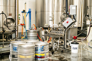 A Modern Beer Factory. Rows of steel tanks for beer fermentation and maturation