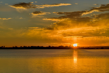 Fototapeta premium Sunrise at City Lake - A colorful autumn sunrise at Marston Lake, Denver, Colorado, USA.
