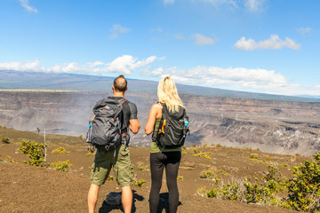 The Hiking couple seeing volcano national park from crater on the caldera Halemaumau around Hawaii volcanoes national park