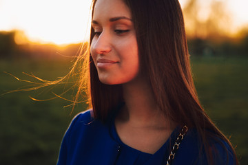 Portrait photo at sunset.Brunette close-up.Selective focus