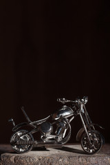 Fototapeta na wymiar Handmade miniature of a motorcycle
