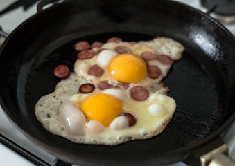 Fried eggs from chicken eggs in a pan
