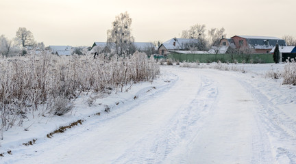 Fototapeta na wymiar Snowy winter in the countryside. Nature in hoarfrost