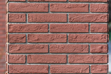 Fototapeta premium Background of red cement bricks in direct sun light, geometrical pattern