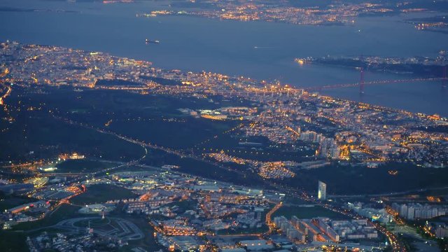 Aerial view of 25 April Bridge, Lisbon. Both river banks of tagus. Montijo Monsanto Barreiro Cacilhas Almada, A5 cascais highway and lighthouse of mama
