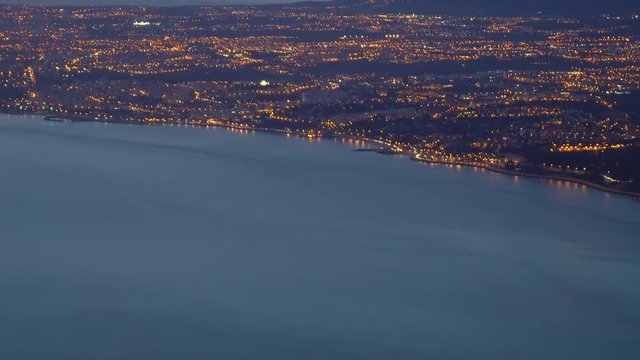Aerial night view of Bugio Fort, Oeiras Carcavelos Sintra Paco de Arcos and Lisbon, with Sintra mountains in the background and city lights.
