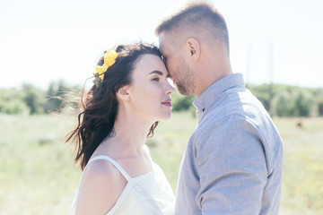 Wedding walk in the pine forest. Sunny day. Wedding couple in the forest. Beautiful Bride and groom on a walk. White wedding dress. Bouquet of peonies and hydrangeas.