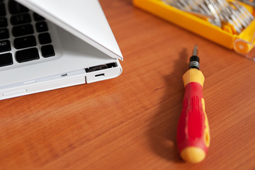 repair loop - hinge laptop. cracked laptop split case. computer equipment maintance service concept.