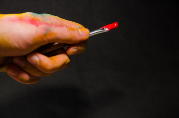 artist holding paintbrush