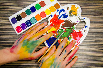 painter hands and gouache colors